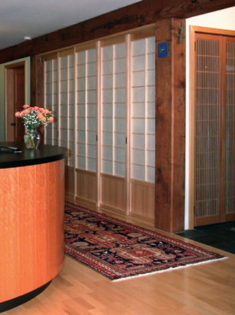 Shoji screens conceal the pantry closet and messy cork board wall