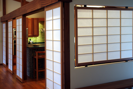 A fixed shoji panel offers light and privacy between the entry and the dining room.