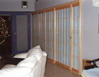 Fixed shoji panels cover wall and create a pocket for the sliding shoji door