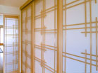Bipart shoji doors using a barn door style tracking system