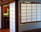 Shoji panel suspended in a wall opening