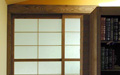 The slding shoji door in the wall built of Japanese shoji screens.