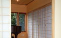 The music room is enclosed in shoji screens, as room dividers and as the audio closet doors.