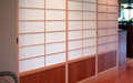Shoji screen room dividers separating the guest room from the entry.