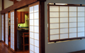 A fixed shoji panel offers light and privacy between the entry and the dining room.