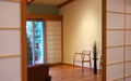 A picture of five shoji screens stacked in the corner when open.